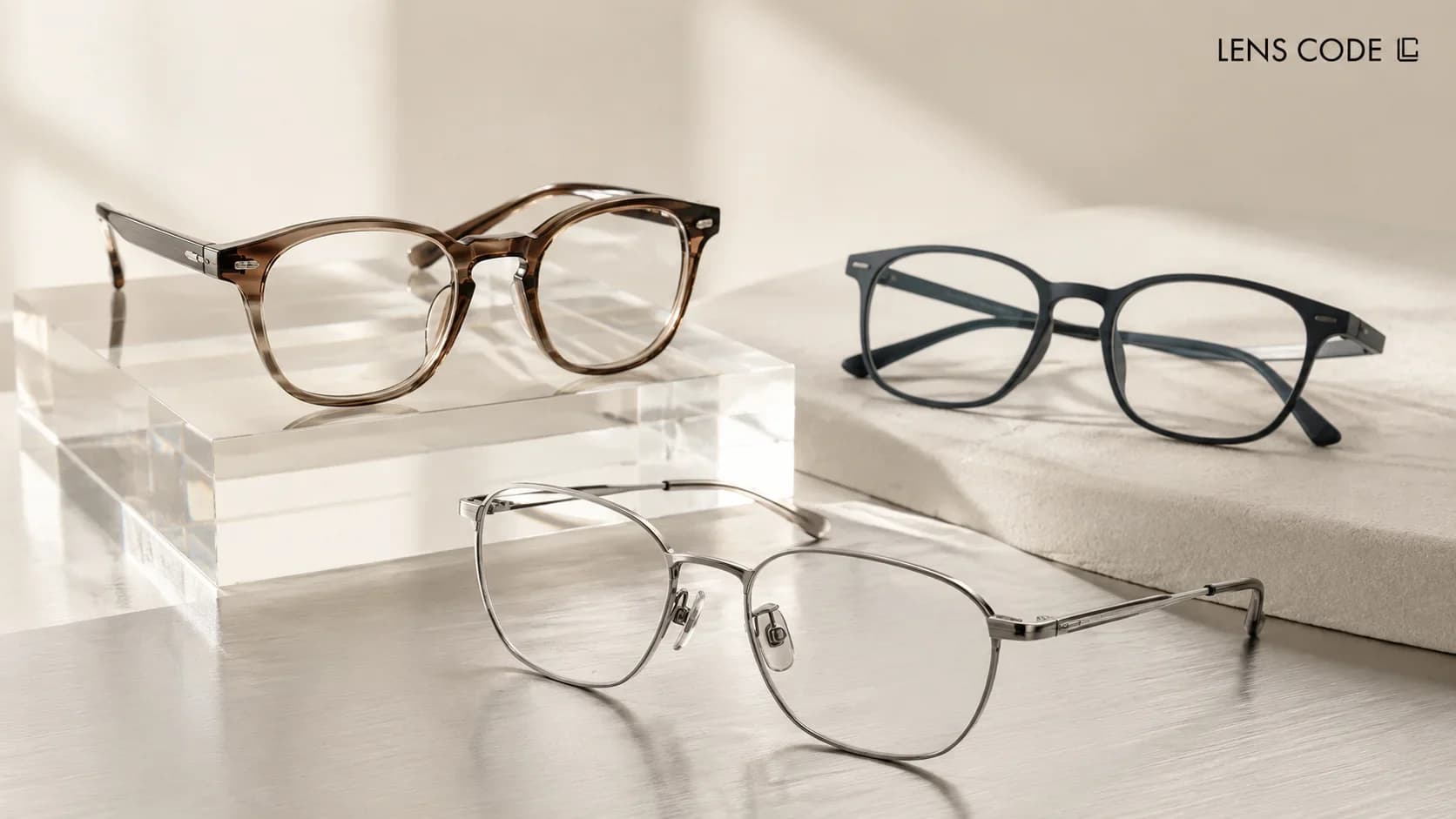 Three eyeglass frames with different designs and finishes for comparing frame materials