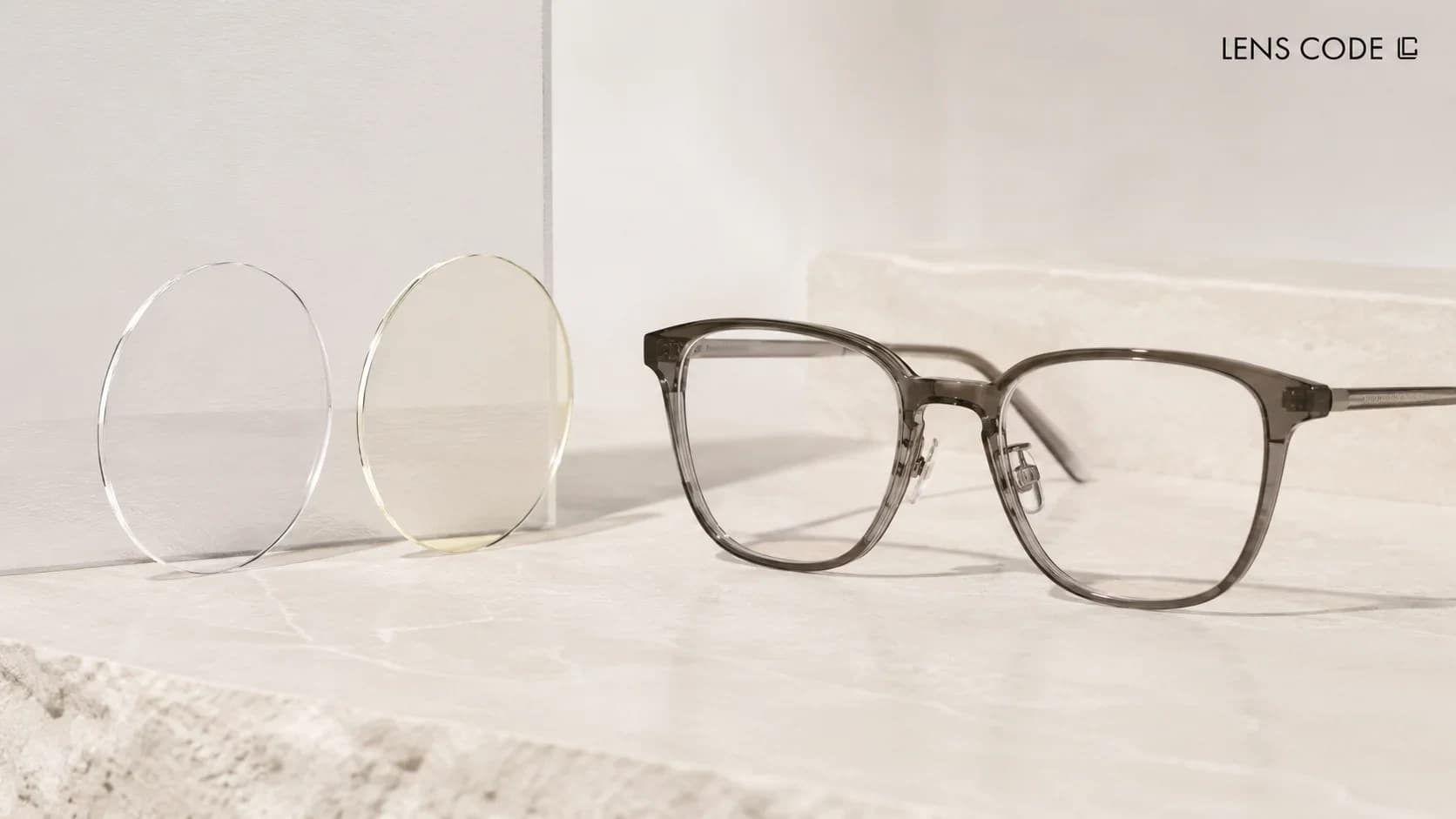 Clear eyeglass lenses compared with spectacle lenses showing a yellow colour change